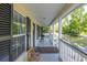 Front porch with gray flooring and white railings at 3260 Cohen Hill Rd, Johns Island, SC 29455