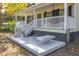 Inviting front porch with white railings and seating area at 3260 Cohen Hill Rd, Johns Island, SC 29455