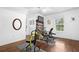Home gym with exercise equipment and hardwood floors at 3260 Cohen Hill Rd, Johns Island, SC 29455
