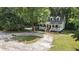 White two-story house with porch and deck at 3260 Cohen Hill Rd, Johns Island, SC 29455