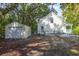 View of the house and detached garage from the backyard at 3260 Cohen Hill Rd, Johns Island, SC 29455