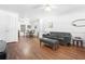 Living room features hardwood floors and a leather couch at 3260 Cohen Hill Rd, Johns Island, SC 29455