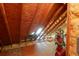 Unfinished attic space with wood framing and a window at 3400 Henrietta Hartford Rd, Mount Pleasant, SC 29466