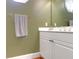 Small bathroom with white vanity and green walls at 3400 Henrietta Hartford Rd, Mount Pleasant, SC 29466