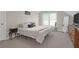 Bright bedroom with a king-size bed, dresser, and large window at 3400 Henrietta Hartford Rd, Mount Pleasant, SC 29466