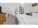 Spacious bedroom with a king-size bed, built-in shelves, and access to a bathroom at 3400 Henrietta Hartford Rd, Mount Pleasant, SC 29466