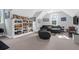 Versatile bonus room featuring comfortable seating, built-in shelving, and large windows at 3400 Henrietta Hartford Rd, Mount Pleasant, SC 29466