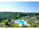Aerial view of community pool, clubhouse, and surrounding landscape at 3400 Henrietta Hartford Rd, Mount Pleasant, SC 29466