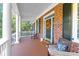 Front porch with white columns and comfortable seating at 3400 Henrietta Hartford Rd, Mount Pleasant, SC 29466