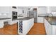 Modern kitchen featuring white cabinets, stainless steel appliances, and hardwood floors at 3400 Henrietta Hartford Rd, Mount Pleasant, SC 29466