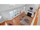 High-angle view of a spacious living room with hardwood floors, fireplace, and access to a deck at 3400 Henrietta Hartford Rd, Mount Pleasant, SC 29466
