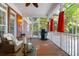 Screened porch with wicker furniture, a grill and string lights at 3400 Henrietta Hartford Rd, Mount Pleasant, SC 29466