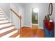 Bright entryway with hardwood floors, staircase, and powder room at 3400 Henrietta Hartford Rd, Mount Pleasant, SC 29466
