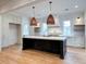 Stylish kitchen with dark island, marble countertops, and a statement range hood at 3894 Summerton St, Mount Pleasant, SC 29466