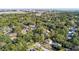 An aerial view showcasing a house's location in a quiet, tree-lined neighborhood near the water at 5 Chadwick Dr # 5-B, Charleston, SC 29407