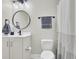 Clean bathroom with toilet, shower, and white vanity at 700 Kilarney Rd, Summerville, SC 29483