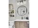 Charming small bathroom with a modern vanity and round mirror at 700 Kilarney Rd, Summerville, SC 29483