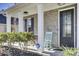 Inviting front porch with rocking chairs and landscaping at 700 Kilarney Rd, Summerville, SC 29483