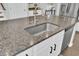 Kitchen island with granite countertop and stainless steel sink at 700 Kilarney Rd, Summerville, SC 29483