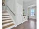 Elegant staircase with wooden steps and white risers at 700 Kilarney Rd, Summerville, SC 29483