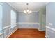 Spacious dining room with hardwood floors and wainscoting at 9044 Parlor Dr, Ladson, SC 29456