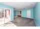 Spacious Gathering room with light blue walls and sliding glass door at 9044 Parlor Dr, Ladson, SC 29456