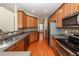 Modern kitchen featuring stainless steel appliances and wood cabinetry at 9044 Parlor Dr, Ladson, SC 29456