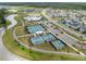 Aerial view of community with tennis courts, pool, and residential homes at 104 True Blue, Summerville, SC 29486