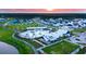 Aerial view of a vibrant community with a pool, clubhouse, and houses at 104 True Blue, Summerville, SC 29486