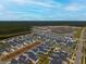 An aerial view of a large residential community near a forest and undeveloped land at 104 True Blue, Summerville, SC 29486