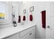 Modern bathroom vanity with white cabinets and a quartz countertop at 104 True Blue, Summerville, SC 29486