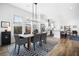 Open concept dining room with wood table and kitchen view at 104 True Blue, Summerville, SC 29486