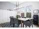 Dining room features a wood table, gray chairs, and stylish light fixture at 104 True Blue, Summerville, SC 29486