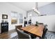 Bright dining room with wood table, gray chairs, and backyard view at 104 True Blue, Summerville, SC 29486