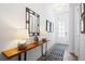 Elegant entryway with console table, lamps, and a framed mirror at 104 True Blue, Summerville, SC 29486