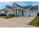 Two-car garage and attractive landscaping enhance this charming home's curb appeal at 104 True Blue, Summerville, SC 29486