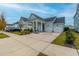 Two-car garage and attractive landscaping enhance this charming home's curb appeal at 104 True Blue, Summerville, SC 29486