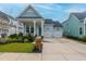 Charming light blue house with a two-car garage and landscaped front yard at 104 True Blue, Summerville, SC 29486