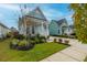 Light blue house with a well-manicured lawn and inviting front porch at 104 True Blue, Summerville, SC 29486