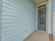 Gray front door adds curb appeal to the light blue house at 104 True Blue, Summerville, SC 29486
