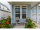 Relaxing front porch with rocking chairs and potted plants at 104 True Blue, Summerville, SC 29486