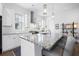 Modern kitchen with white cabinets, granite counters, and a large island at 104 True Blue, Summerville, SC 29486