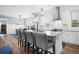 White kitchen with granite island, stainless steel appliances & breakfast bar at 104 True Blue, Summerville, SC 29486