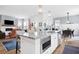 Open concept kitchen with island, granite counters & view into living room at 104 True Blue, Summerville, SC 29486