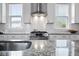 Stainless steel appliances and granite countertops highlight this kitchen at 104 True Blue, Summerville, SC 29486