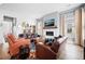 Bright living room features a fireplace and comfortable leather seating at 104 True Blue, Summerville, SC 29486