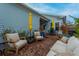 Brick patio with seating area and outdoor umbrella at 104 True Blue, Summerville, SC 29486