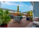 Brick patio with seating area, umbrella, and grill at 104 True Blue, Summerville, SC 29486
