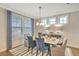 Elegant dining room with hardwood floors, blue chairs, and a stylish light fixture at 137 Winding Grove Ln, Moncks Corner, SC 29461