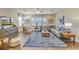Spacious living room with a sectional sofa, large TV, and blue area rug at 137 Winding Grove Ln, Moncks Corner, SC 29461